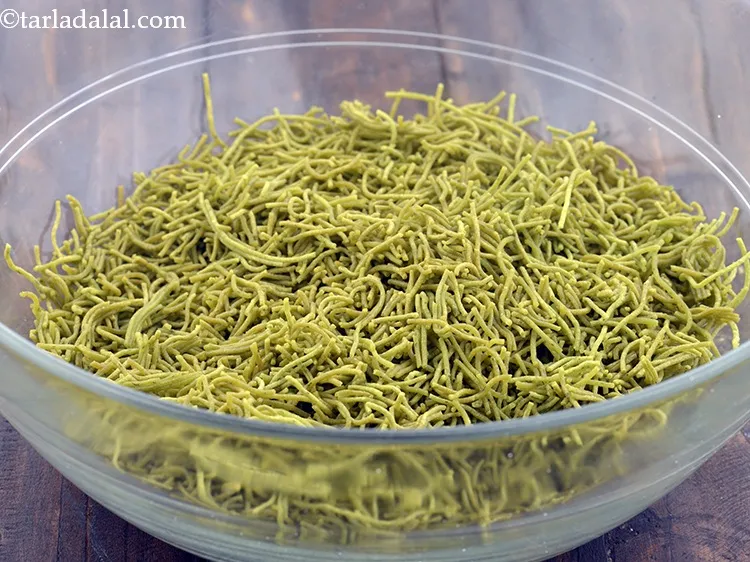 Step 32 – Transfer the sev into a deep bowl. Break the sev into pieces using your fingers.