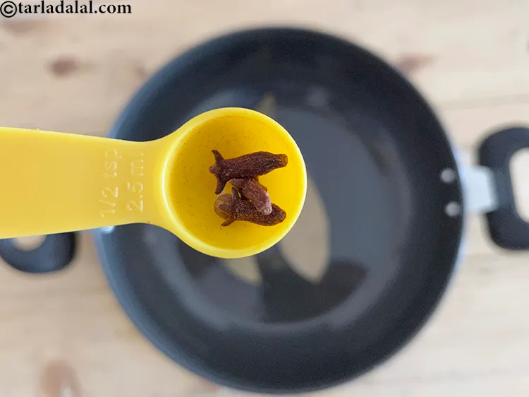 Step 21 – Add&nbsp;<meta charset="UTF-8" />3&nbsp;<a href="glossary-cloves-322i">cloves (laung / lavang)</a>.