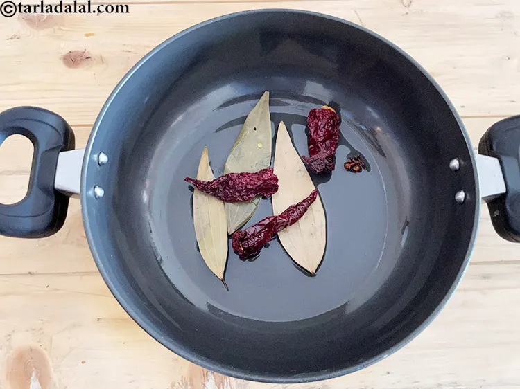 Step 22 – Add&nbsp;<meta charset="UTF-8" />3&nbsp;<a href="glossary-whole-dry-kashmiri-red-chillies-kashmiri-mirch-kashmiri-lal-mirch-332i">whole dry kashmiri red chillies</a>.