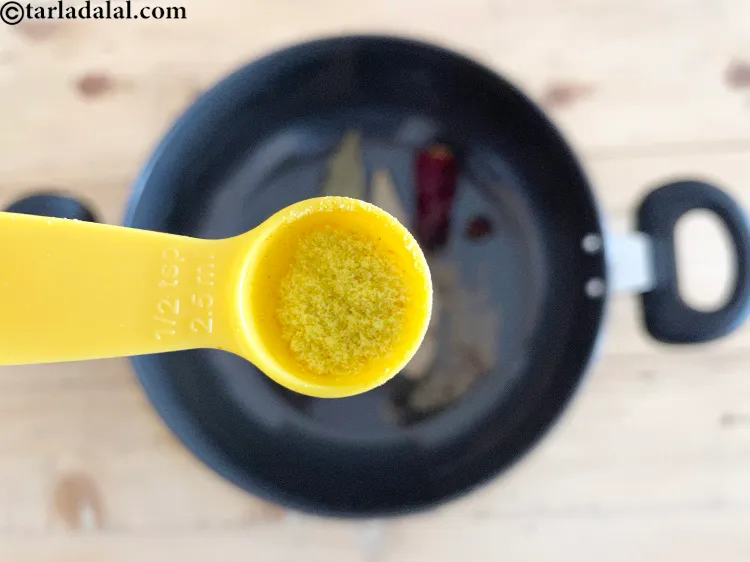 Step 24 – Add&nbsp;<meta charset="UTF-8" />a pinch of&nbsp;<a href="glossary-asafoetida-hing-113i">asafoetida (hing)</a>.