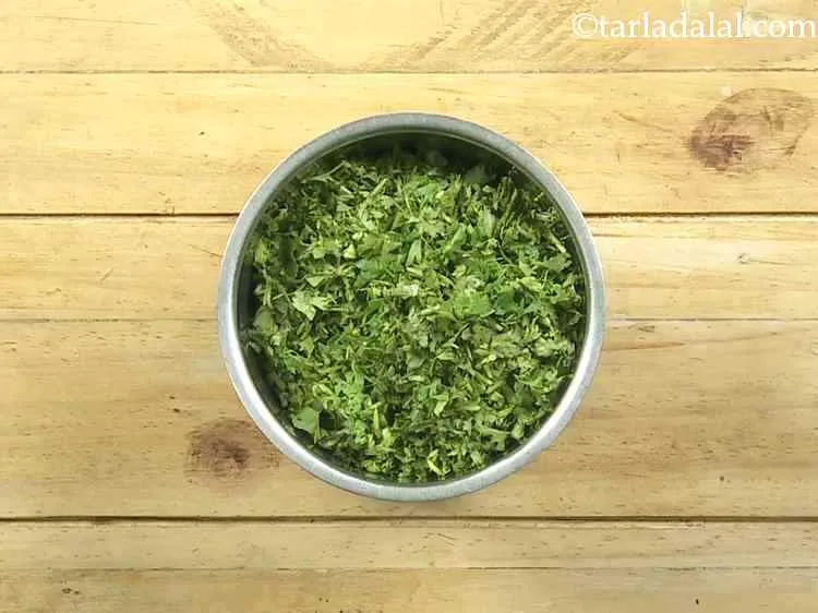 Step 24 – Combine the spring onions and coriander in a small mixer jar.