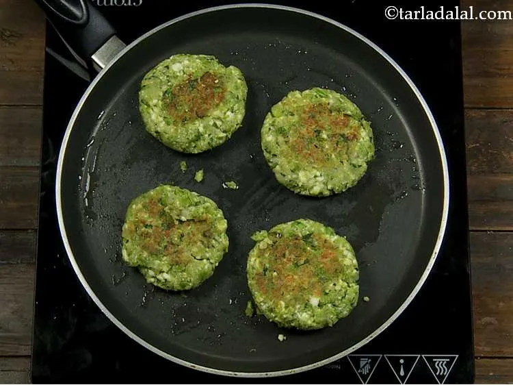 Step 11 – Cook them on both sides, using a little oil, till they turn golden brown in …