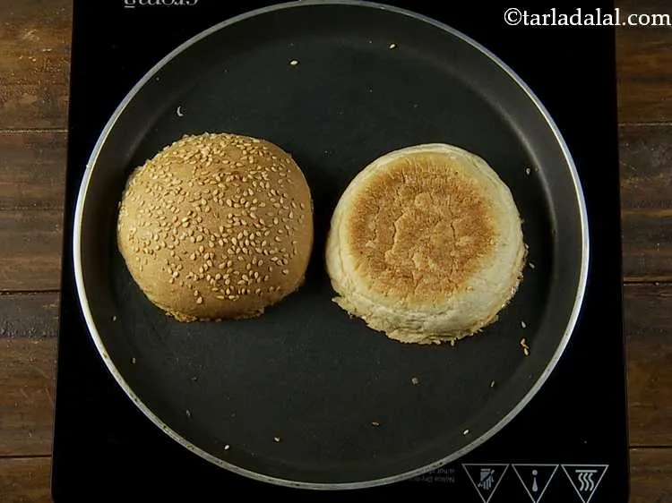 Step 14 – Toast them lightly on a non-stick tava (griddle).