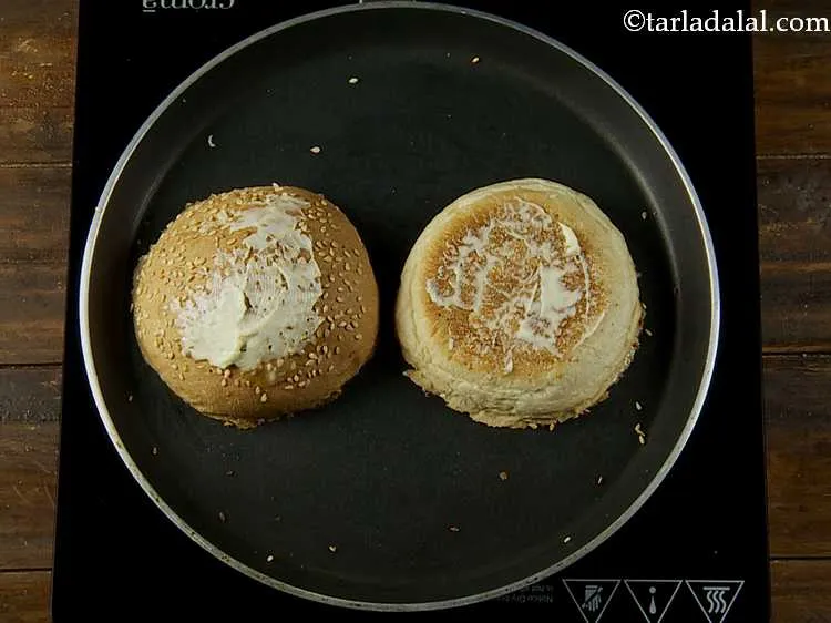 Step 15 – Apply butter on the other sides of each half of the burger bun.