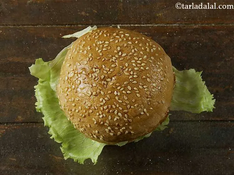 Step 23 – Cover with the upper half of the bun and press it lightly to keep all …