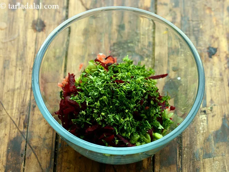 Step 13 – Add finely chopped green chillies and coriander.