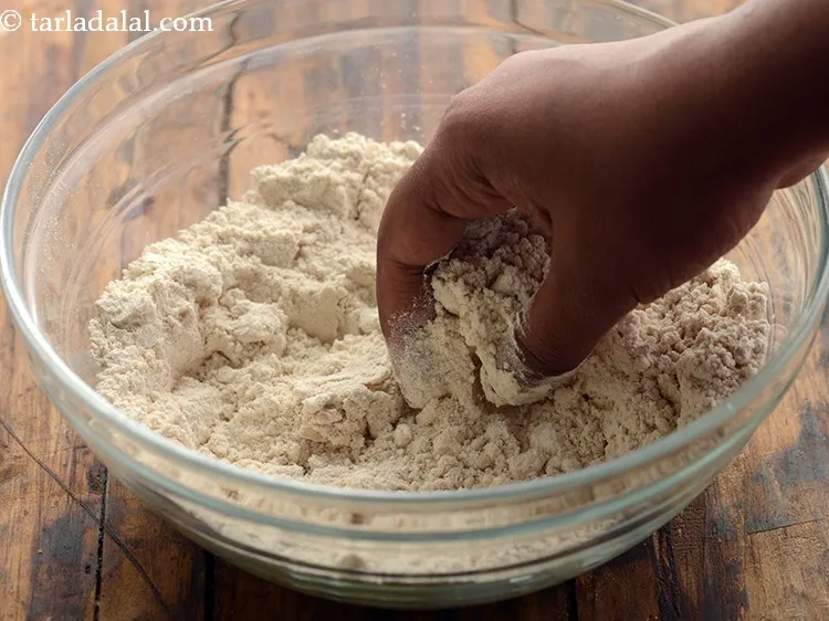 Step 6 – Mix it well with your hands. Gather the flour from all sides. Add more water …