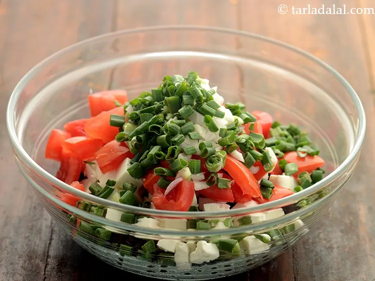 Step 19 – Along with it also add chopped spring onions. Use the whites and greens both. They …