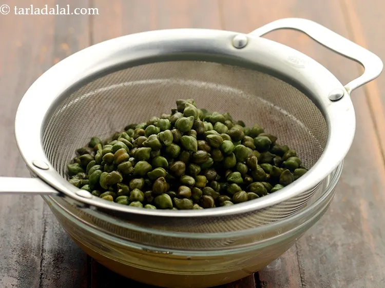 Step 10 – Next day, drain the hara chana using a strainer.