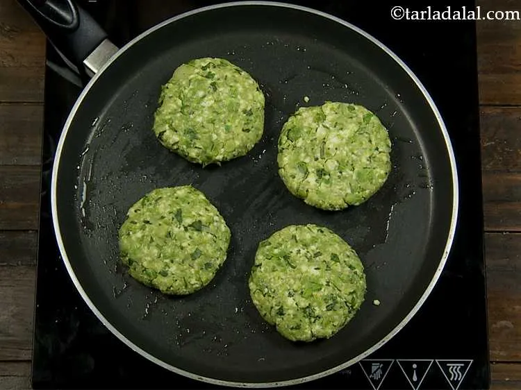Step 10 – Place the cutlets on the hot, greased tava.