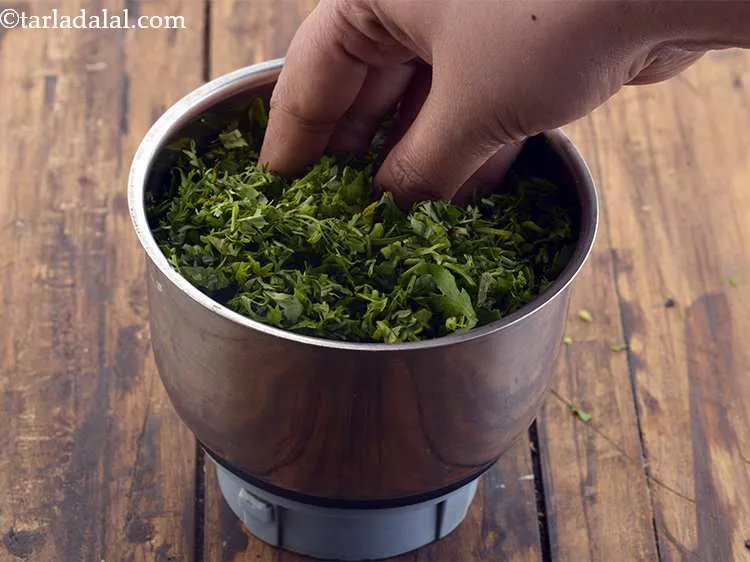 Step 33 – Now, add the chopped coriander (dhania).