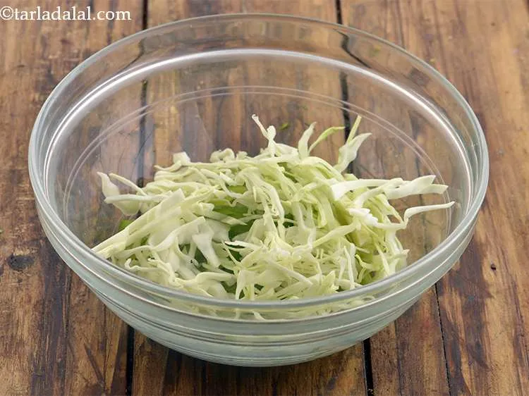 Step 45 – Now add the shredded cabbage. Make sure the cabbage is fresh and crisp. Limp cabbage …