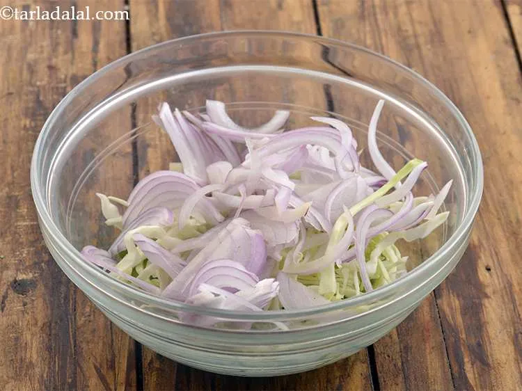 Step 46 – Add the thinly sliced onions. They impart a pungent yet luscious flavor to the salad.