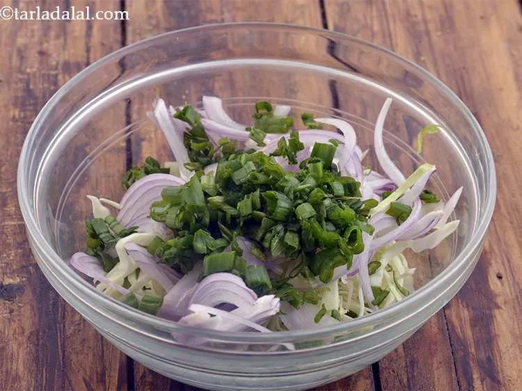 Step 47 – Now add the finely chopped spring onion greens.