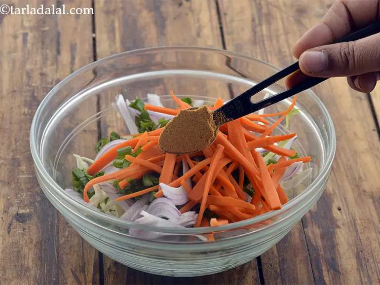 Step 49 – Add the chaat masala. It gives tangy flavor to the salad of <strong>Spicy Paneer Burger.</strong> …