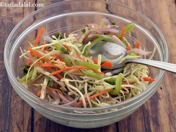 Step 50 – Mix well. Divide the salad into 4 equal portions and keep aside.