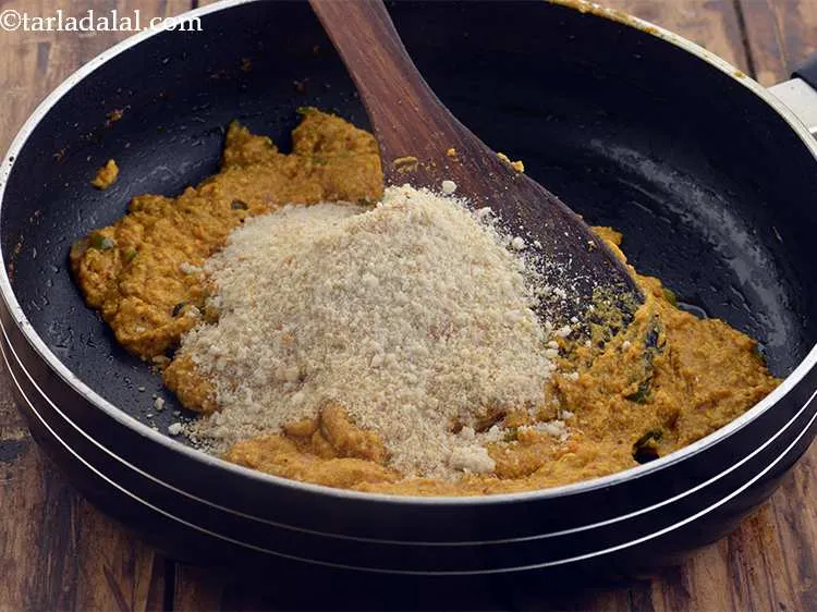 Step 21 – Remove from the flame, add &frac14; cup of bread crumbs and mix well. Keep aside …