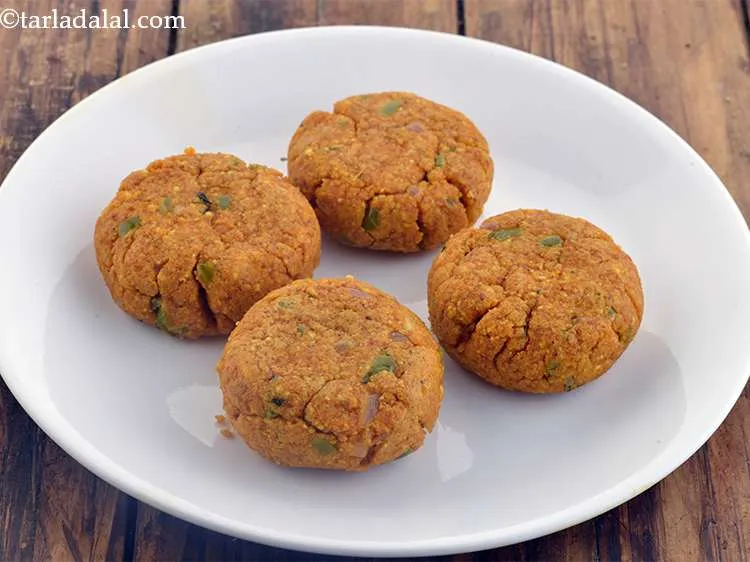 Step 26 – Take a portion of the Paneer mixture and shape it into a circle of 75 …