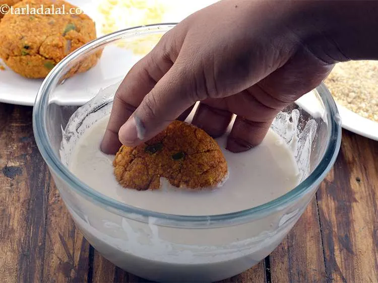 Step 27 – Dip each cutlet in the plain flour-water mixture. This coating will hold everything together and …