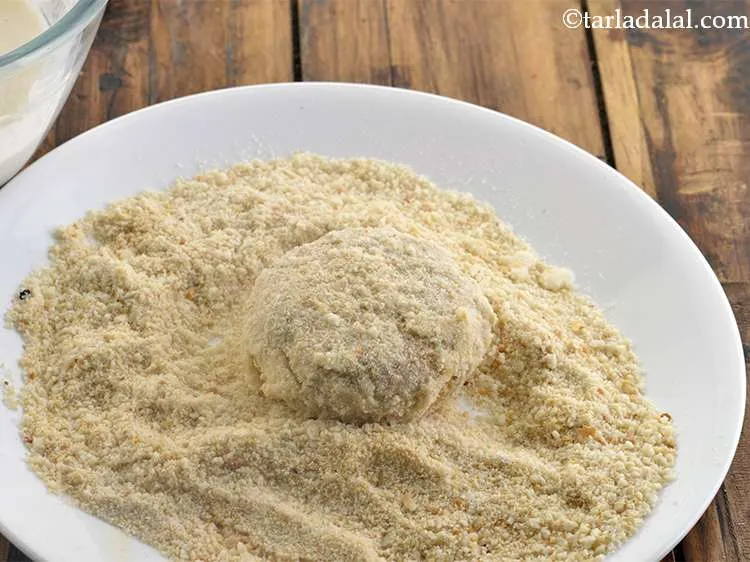 Step 28 – Roll in the remaining &frac12; cup of bread crumbs till it is evenly coated from …