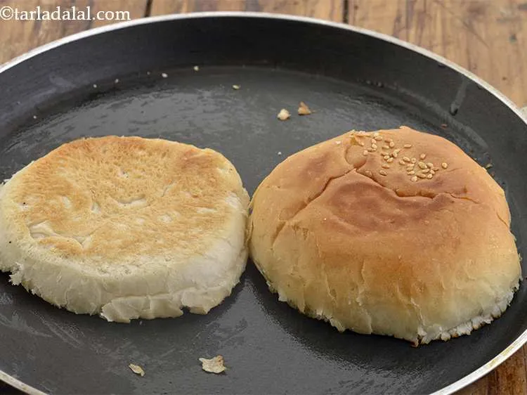 Step 54 – Toast the buns lightly on the tava. Keep aside.
