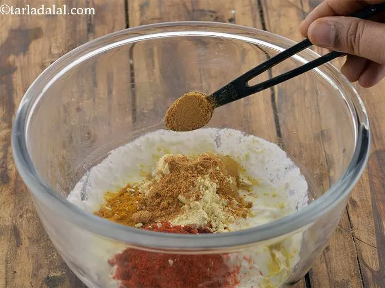 Step 7 – Add the chaat masala. It adds a mild-sour taste to the cutlets.