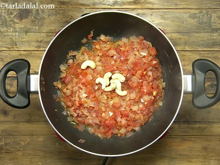 Step 7 – Add the cashew nuts. They provide a rich and creamy texture to the gravy.