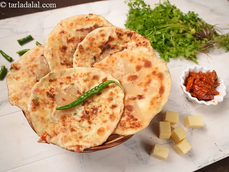 Step 32 – Enjoy <strong>tomato cheese paratha</strong> immediately with raita or achar of your choice.
