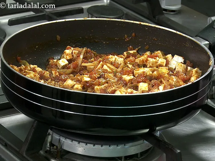 Step 25 – Mix gently and cook on a medium flame for 1 minute. Divide the stuffing into …