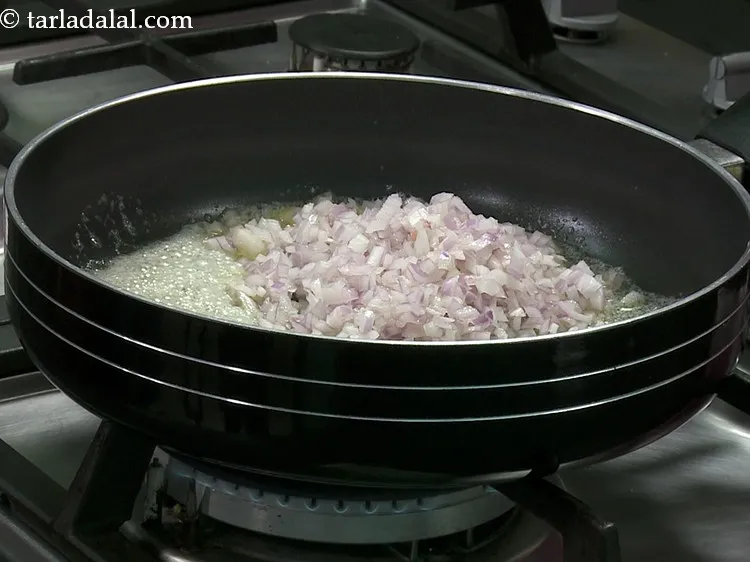 Step 9 – When the butter is hot and melts, add the onions.