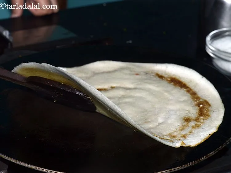 Step 31 – Cook paneer dosa on a medium flame till the dosa turns light brown in colour.
