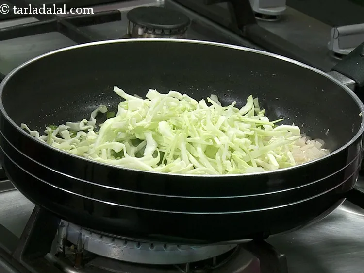 Step 12 – Add cabbage. Make use of any vegetables of your choice like baby corn, purple cabbage, …