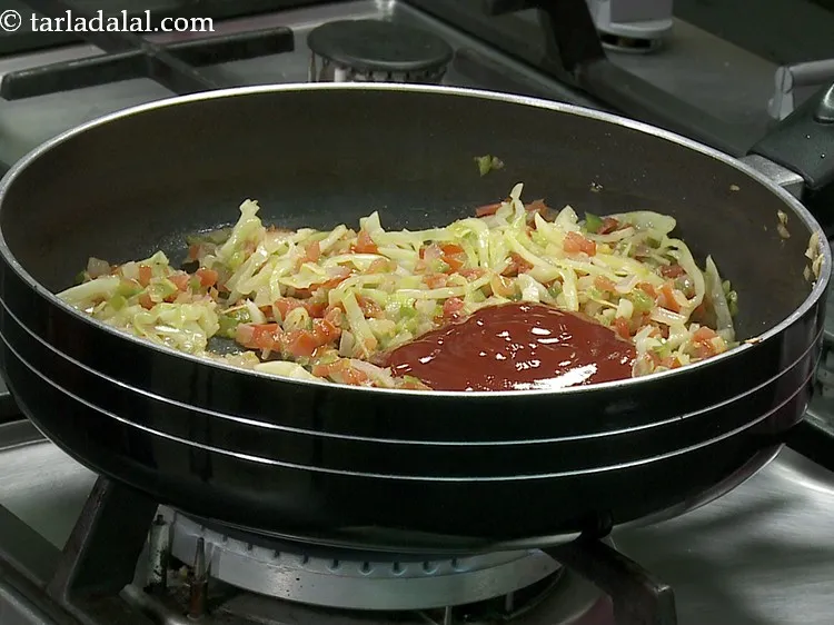 Step 16 – Add the tomato ketchup for a tangy flavour.
