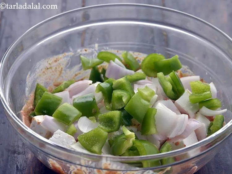 Step 29 – Add the capsicum cubes. You can add vegetables of your choice like tomatoes, broccoli, baby …