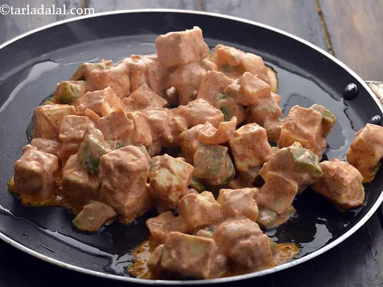 Step 33 – When the tawa is hot enough, place the marinated paneer- capsicum cubes on it. If …