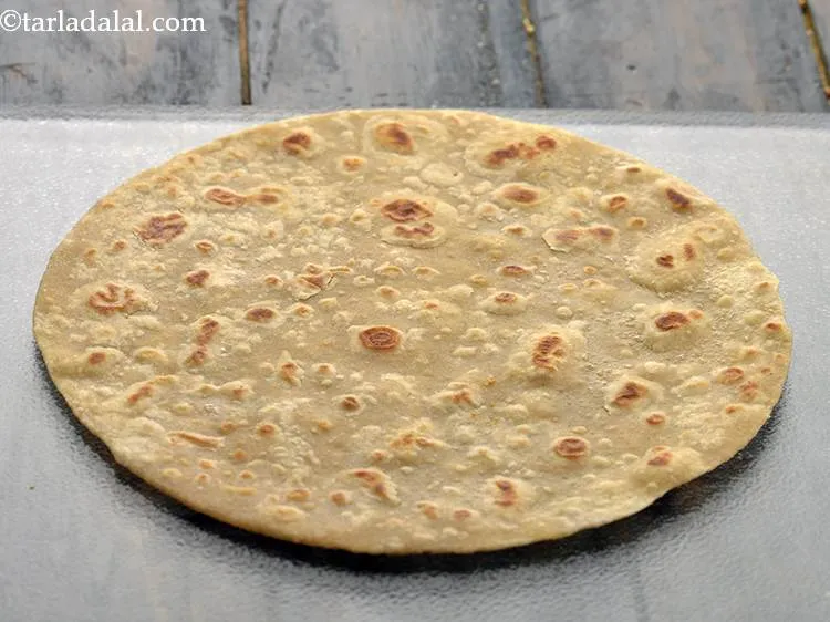 Step 37 – For preparing the <strong>Paneer Tikka Kathi Roll</strong>, place a roti on a clean dry surface. …