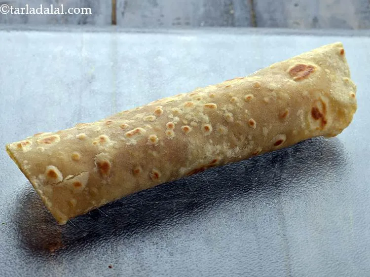 Step 40 – Roll it up tightly and our <strong>Paneer Tikka Kathi</strong> roll is ready.