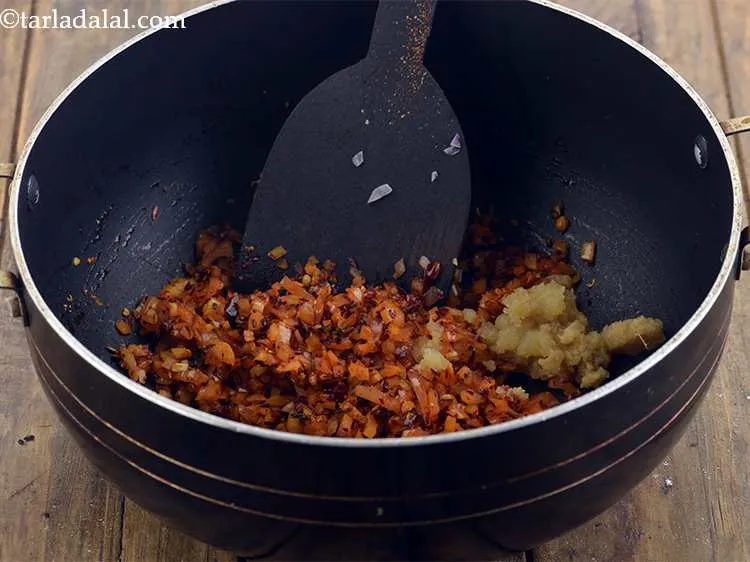 Step 11 – Then add the ginger-garlic paste. These give the base flavor for many other <a href="https://www.tarladalal.com/recipes-for-Punjabi-Subzis-8"><em><strong>punjabi …