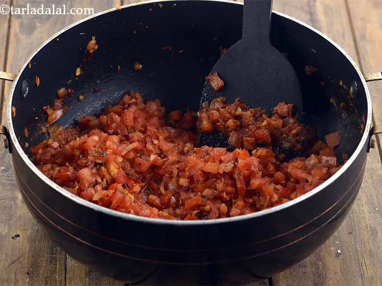 Step 27 – add the tomatoes, mix well and cook for 1 minute on a medium flame, while …