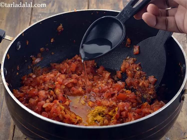 Step 15 – Also add 2 tbsp of water. We add this water so that the tomatoes do …