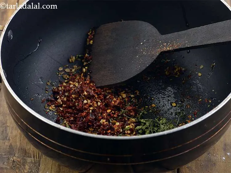 Step 8 – Add dried fenugreek leaves or kasoori methi into the pan after crushing them lightly between …