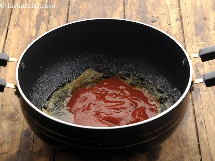 Step 18 – Add tomato puree.