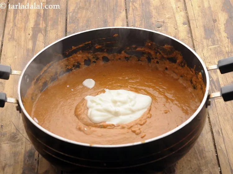 Step 21 – Add the curd. This is optional and you can make use of fresh cream instead.