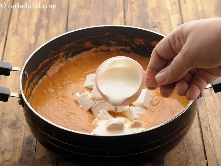 Step 26 – Add cream. It provides a rich texture to the <strong>Paneer Makhani recipe</strong>.