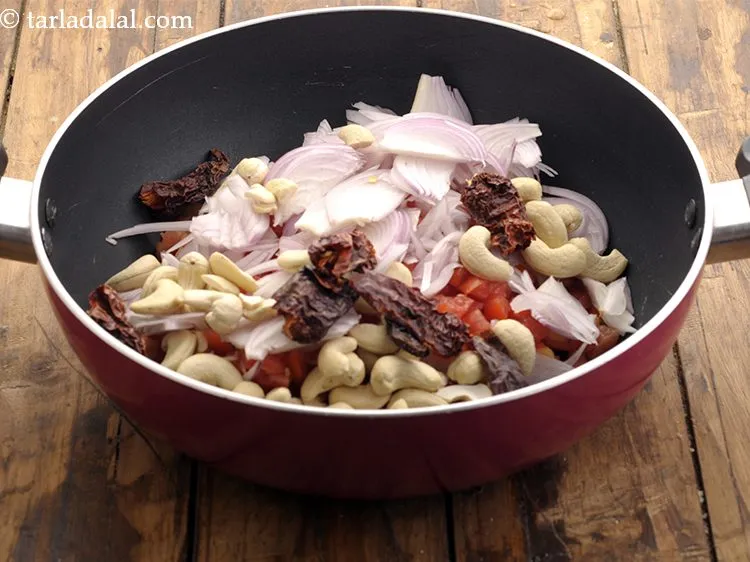 Step 5 – Add Kashmiri red chillies. We have removed the stalk and broken them into pieces before …