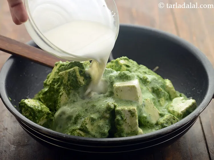 Step 19 – Add milk to adjust the consistency of the <strong>paneer makhmali gravy</strong>.