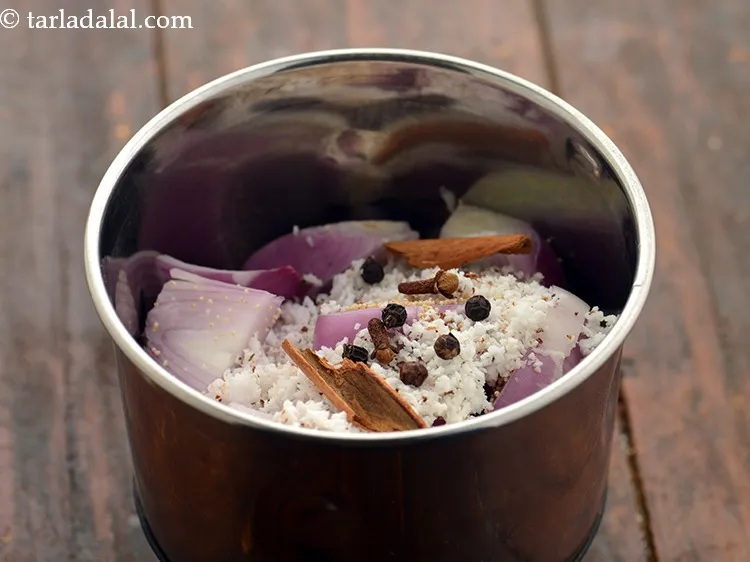Step 6 – Add cloves and peppercorns to enhance the flavor of the quick and easy paneer masala.