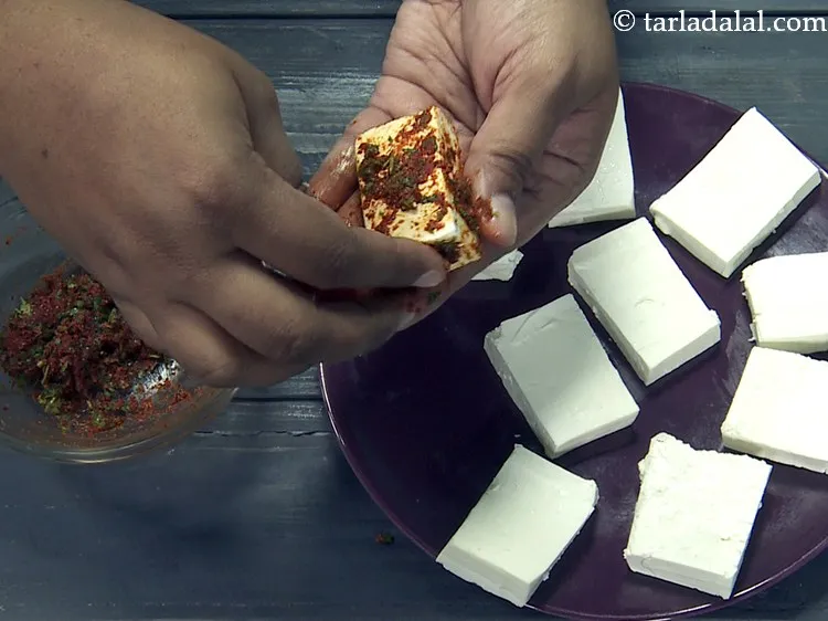 Step 19 – Spread the marinade over each paneer piece evenly. Ensure to cover all the sides well.&nbsp;