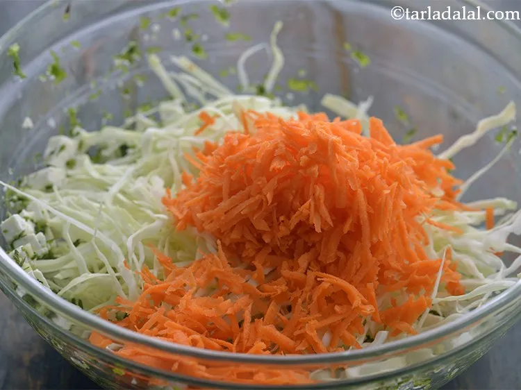 Step 35 – Add the grated carrot. You can toss in other vegetables like grated beetroot, shredded purple …