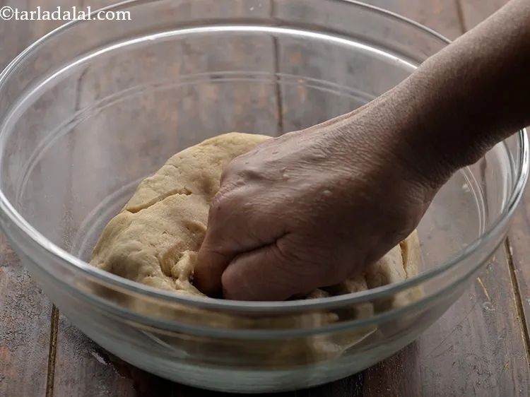 Step 15 – Press the pita bread dough lightly to remove the air.